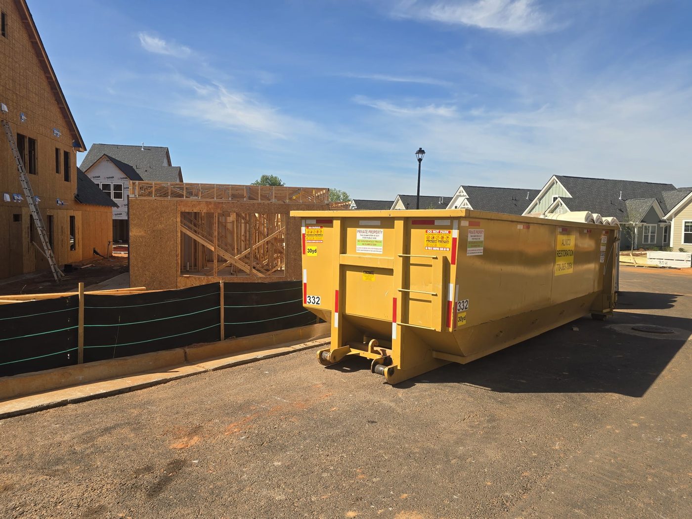 30yd container at new construction framing site