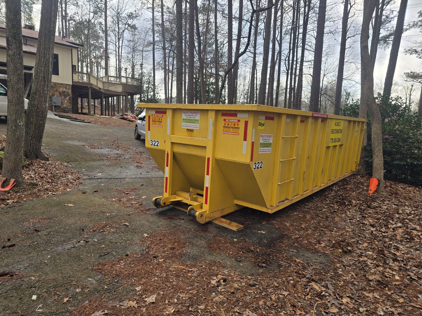 30yd container at wooded residential property