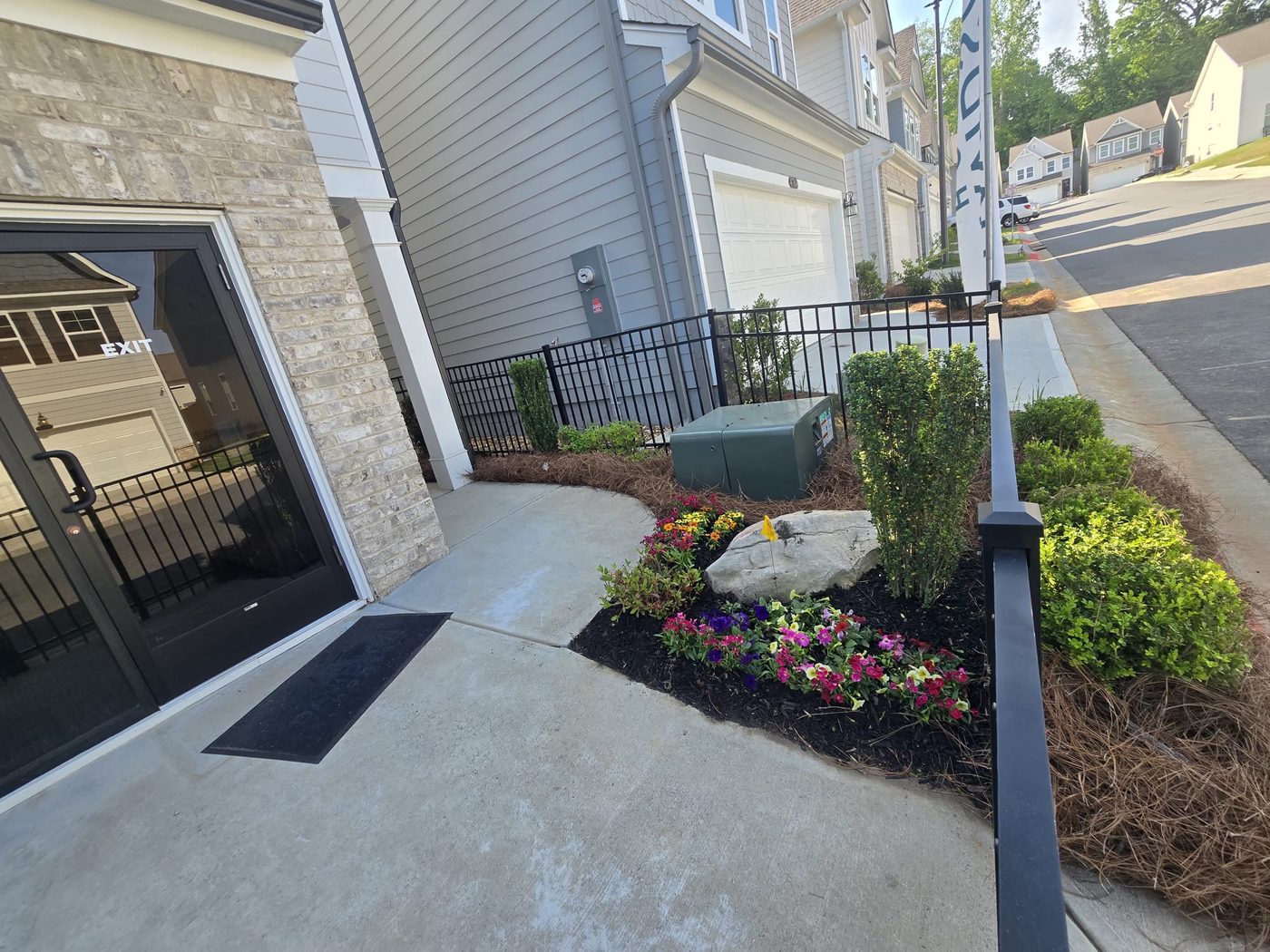 Bed with petunias and feature rock